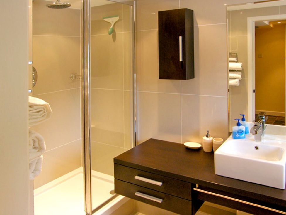 A bathroom with a shower and sink at Howle Hideaway in Ross-on-Wye
