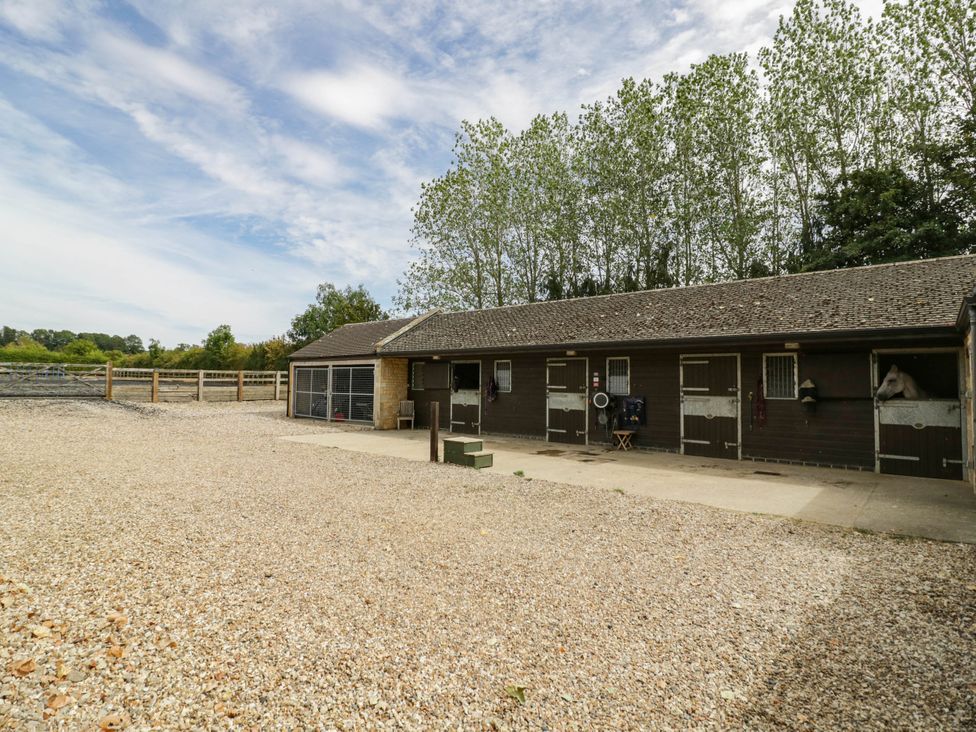 An outdoor stable area with horse stalls at Wayside in Moreton-in-Marsh
