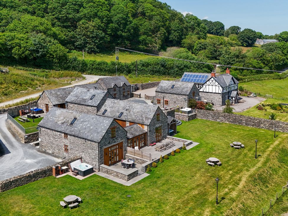 An outdoor area with buildings and gardens at The Granary in Corwen