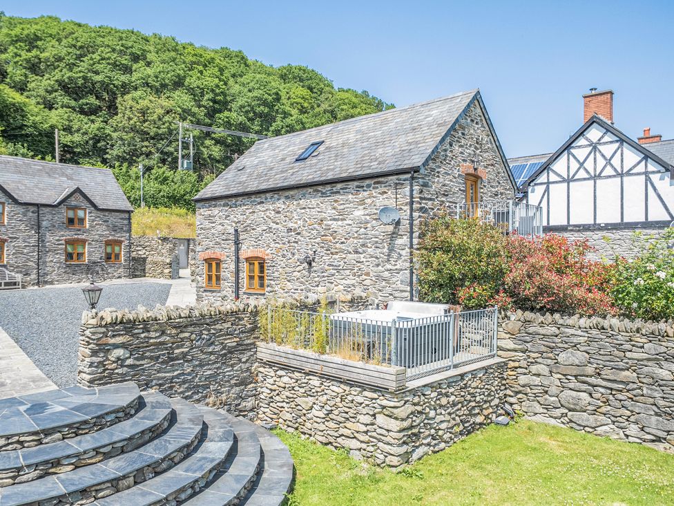 A stone house with garden and steps at The Granary in Corwen