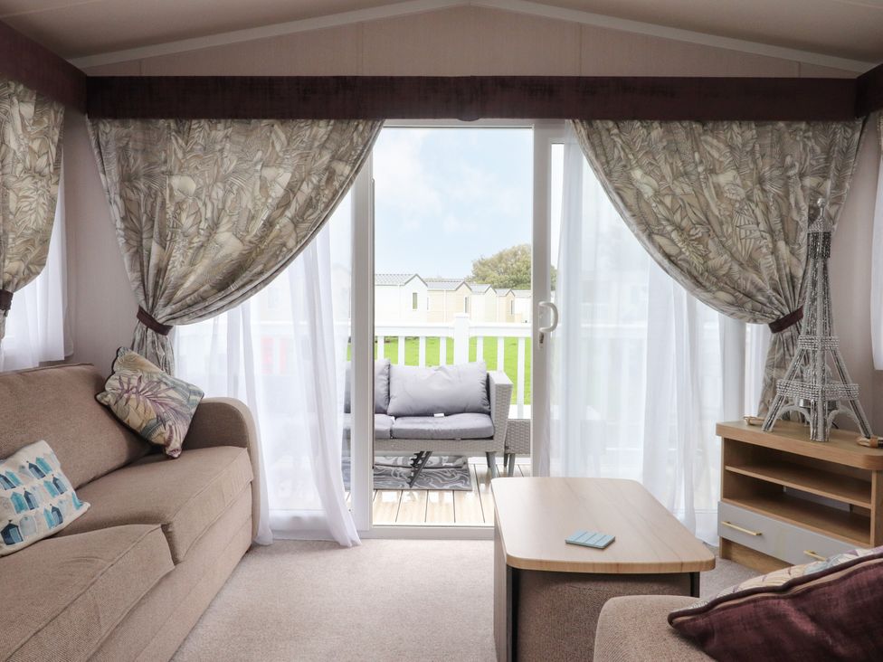 A living room with a sofa and table at Marton Mere Westminster in Blackpool