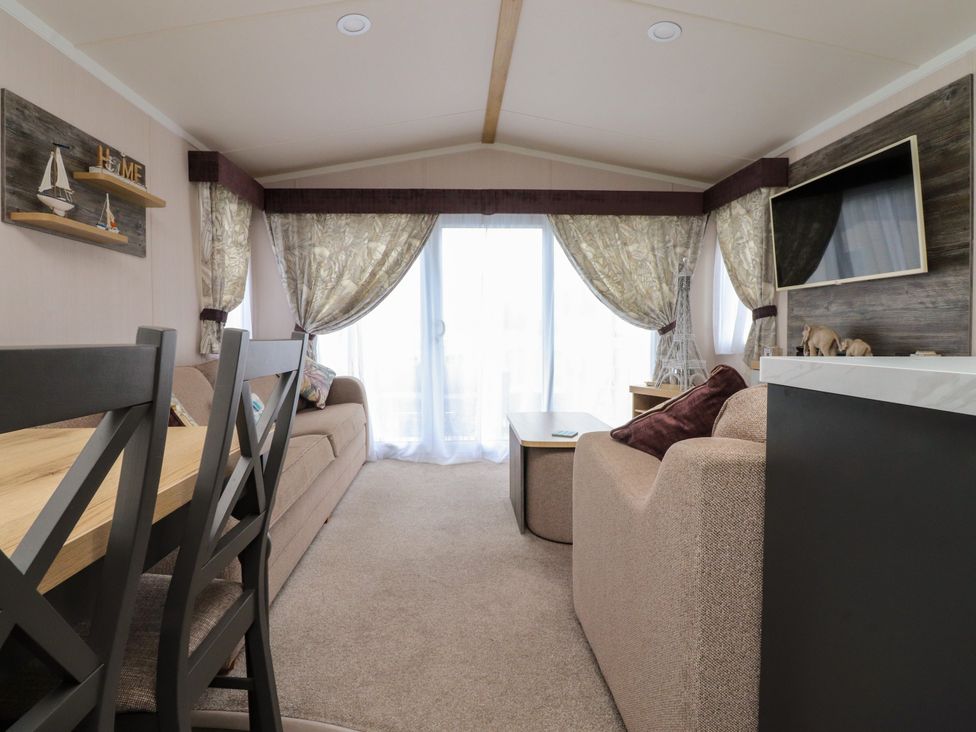 A living room with a sofa and table at Marton Mere Westminster in Blackpool