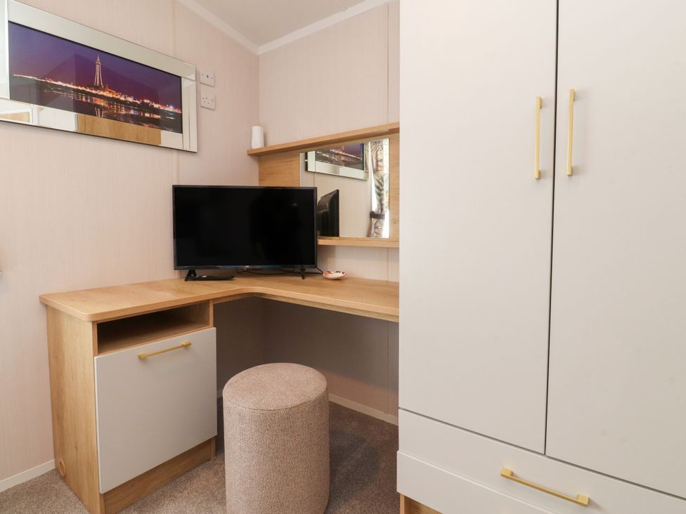 An office with a desk and a TV at Marton Mere Westminster in Blackpool