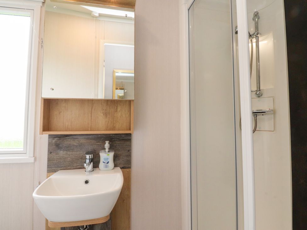 A bathroom with a sink and shower at Marton Mere Westminster in Blackpool