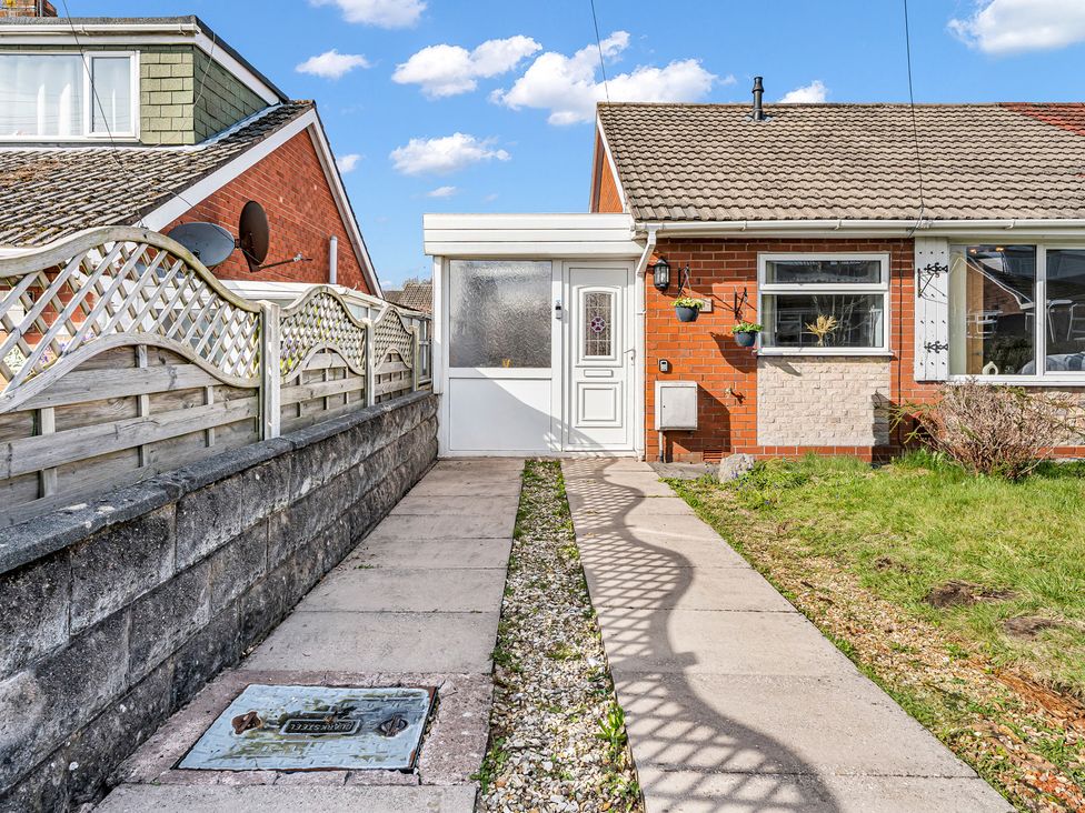 A front entrance with a pathway, door, and fence at Mallory House in Stoke-on-Trent