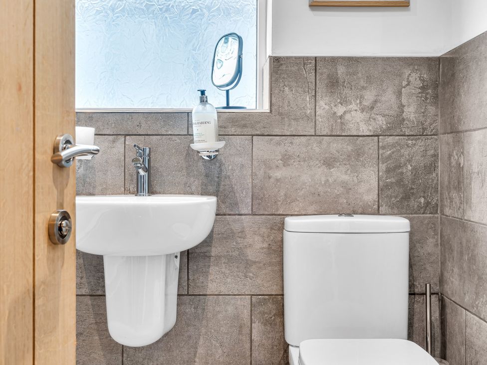 A bathroom with a sink and toilet at Mallory House in Stoke-on-Trent
