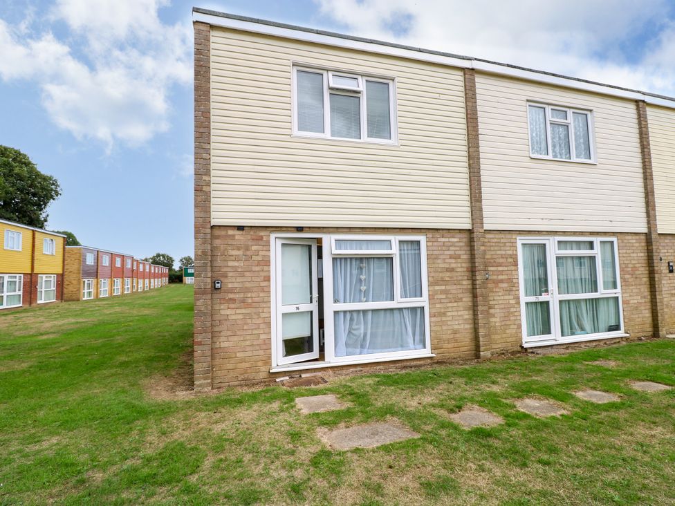 A building exterior with lawn at Leaf Lodge Hemsby
