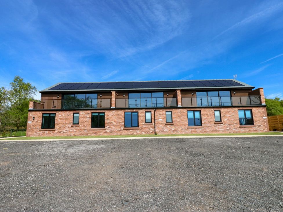 A building with windows and balconies at Oak Tree Cottage in Frizington