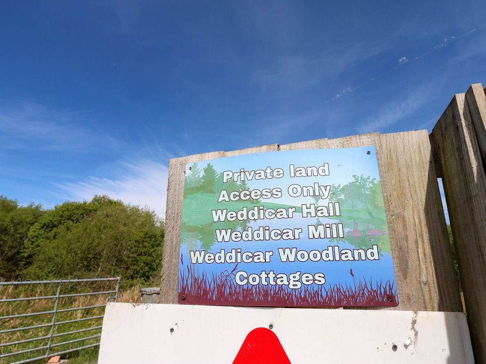A sign indicating private land access at Weddicar Hall in Frizington