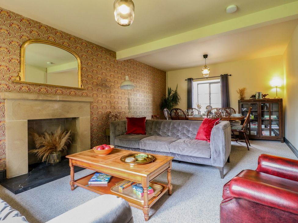 A living room with a sofa and coffee table at Haarlem House in Wirksworth