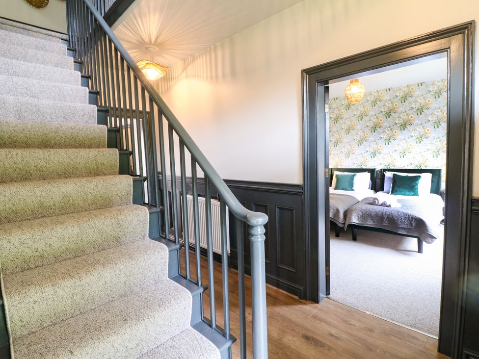 A hallway with stairs leading to a bedroom at Haarlem House in Wirksworth