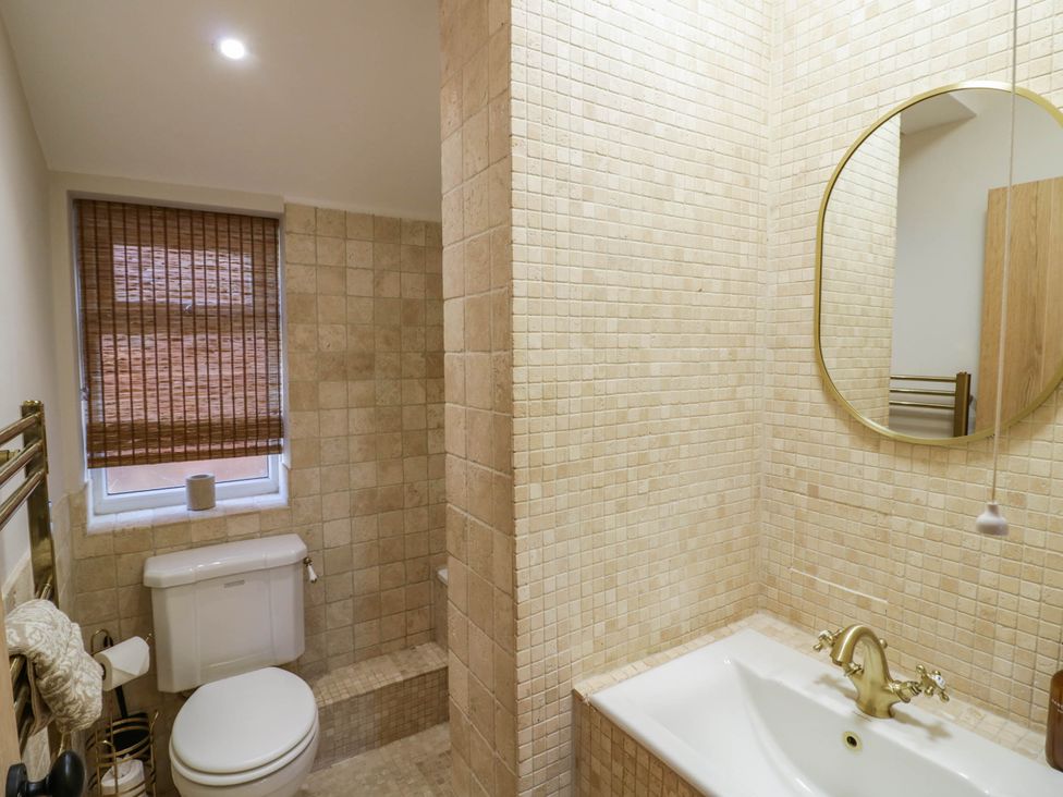 A bathroom with a toilet and sink at Albert Cottage in Stratford-upon-Avon