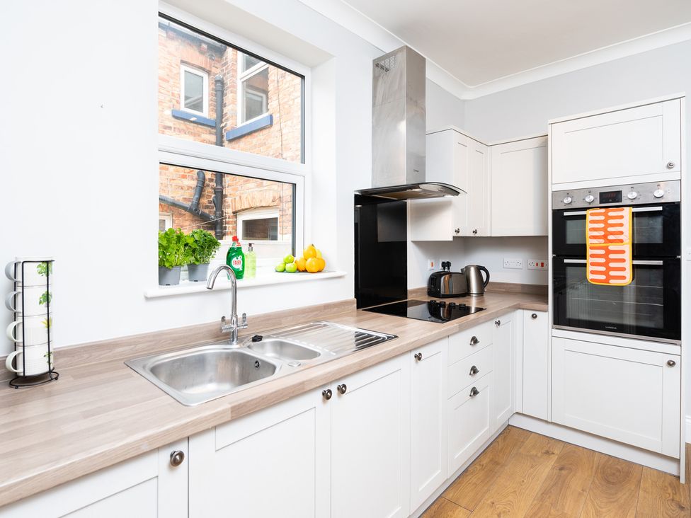 A kitchen with a sink, kettle, oven, and herbs at 38 Ashville Avenue Scarborough