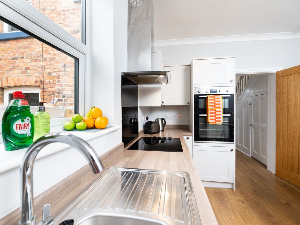A kitchen with a sink and oven at 38 Ashville Avenue, Scarborough