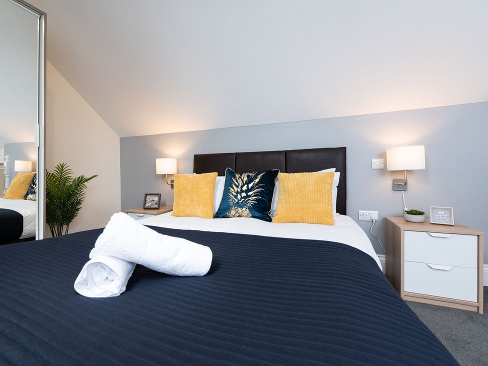 A bedroom with a bed and bedside table at 38 Ashville Avenue Scarborough