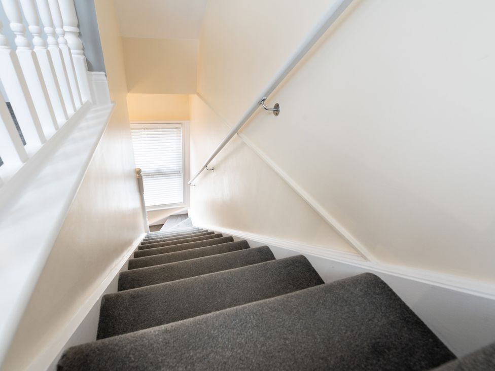 A stairwell with stairs and a handrail at 38 Ashville Avenue Scarborough