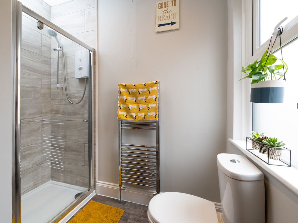 A bathroom with a shower and a toilet at 38 Ashville Avenue Scarborough