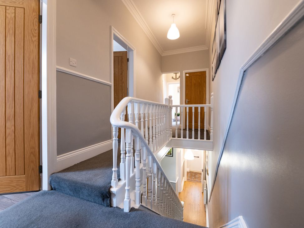 A hallway with stairs leading to doors at 38 Ashville Avenue Scarborough