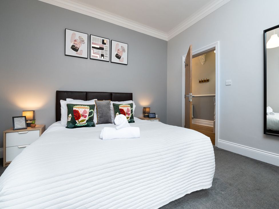 A bedroom with a bed and bedside tables at 38 Ashville Avenue Scarborough