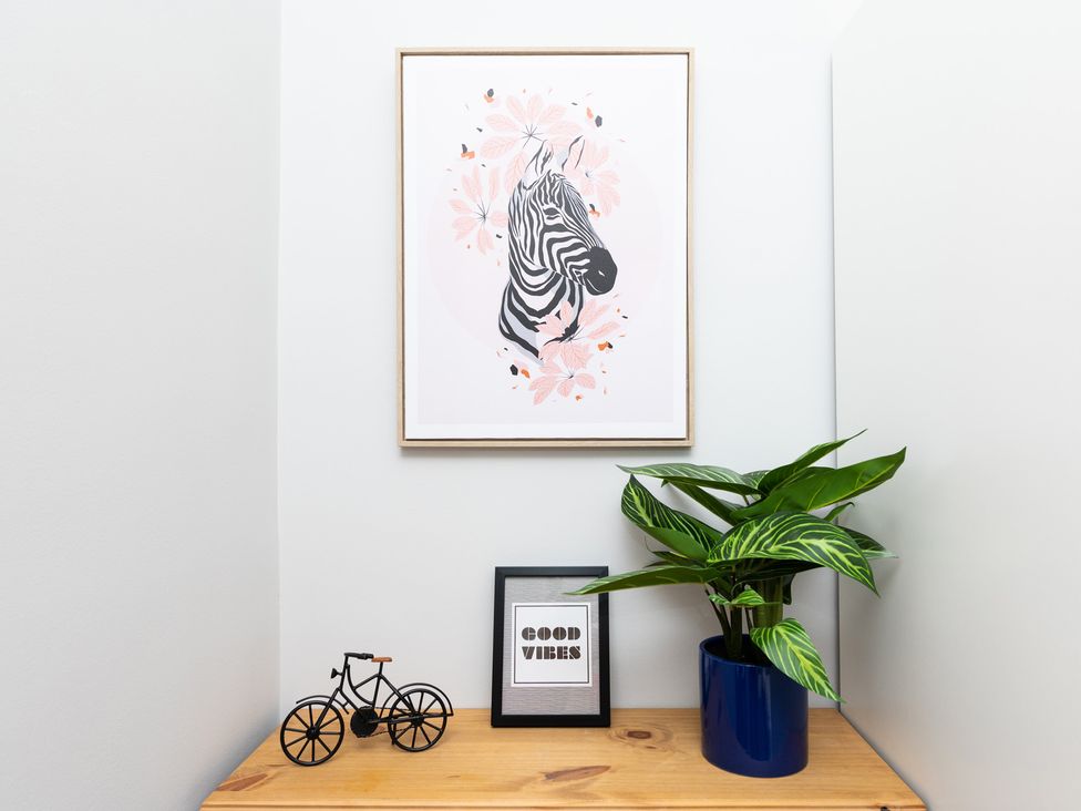 A corner display with zebra print art, a plant, and a framed quote at 38 Ashville Avenue, Scarborough