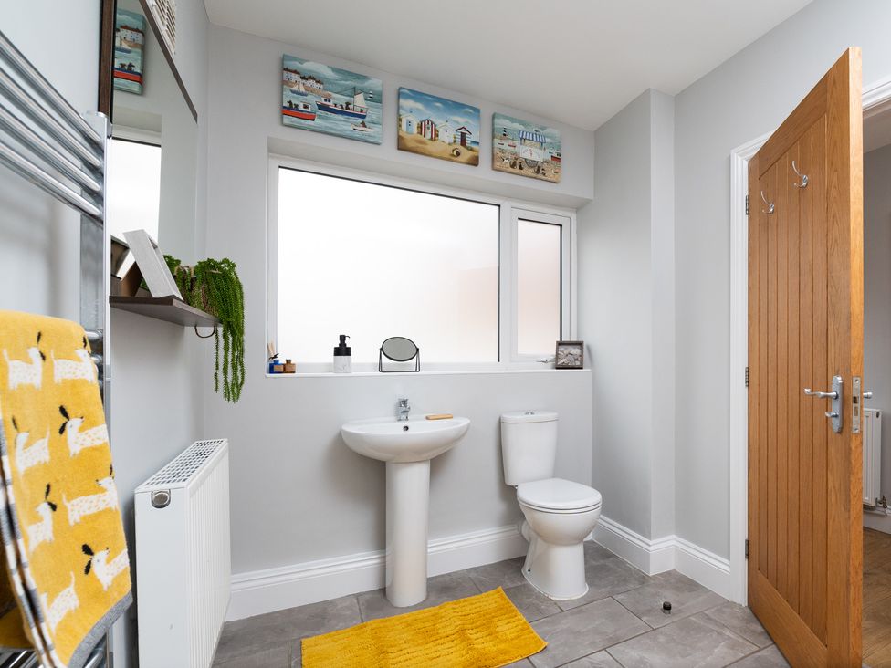 A bathroom featuring a sink and toilet at 38 Ashville Avenue Scarborough
