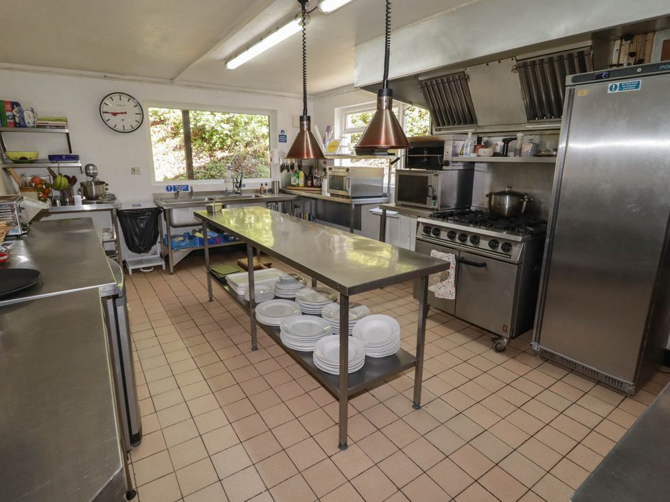 A kitchen with stainless steel countertops and appliances at Ty Mawr Country House in Carmarthen