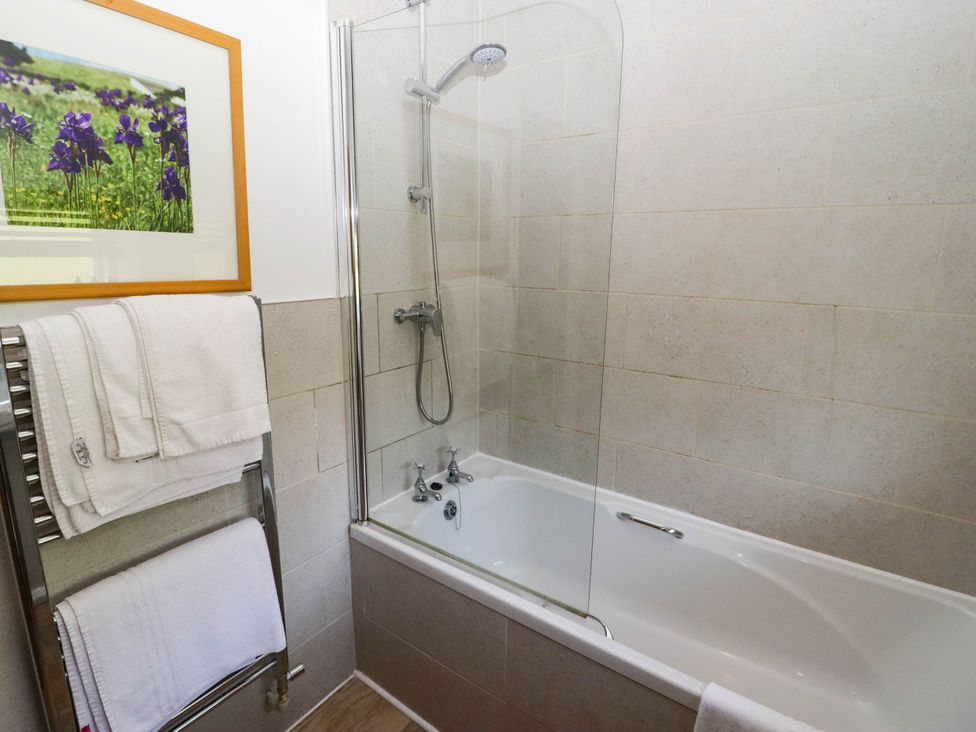 A bathroom with a bathtub and shower at Ty Mawr Country House in Carmarthen