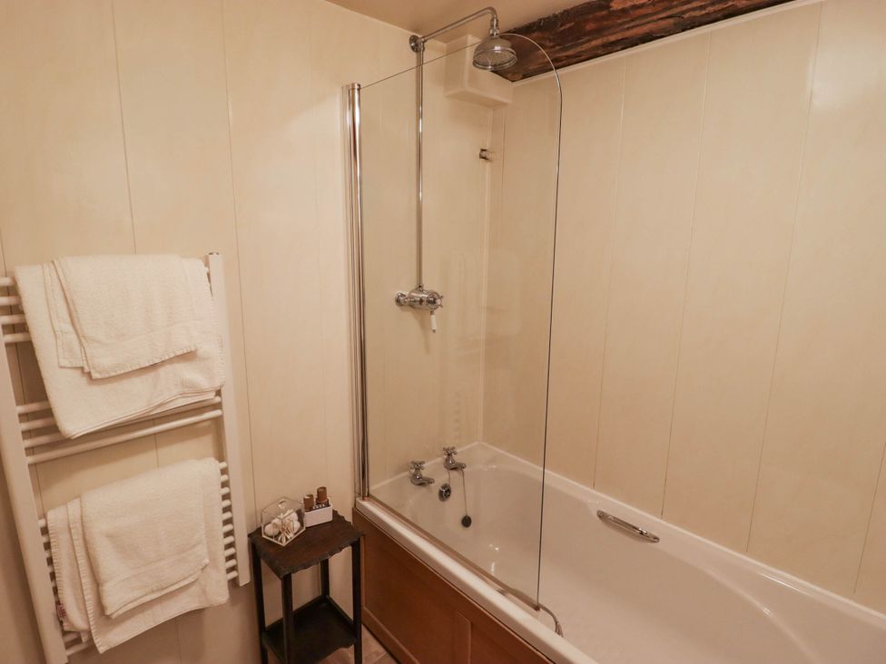 A bathroom with a bathtub and shower at Ty Mawr Country House in Carmarthen