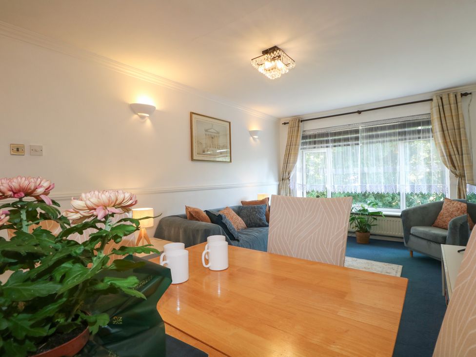 A dining room with a table and chairs at 4 Sussex Close Watford