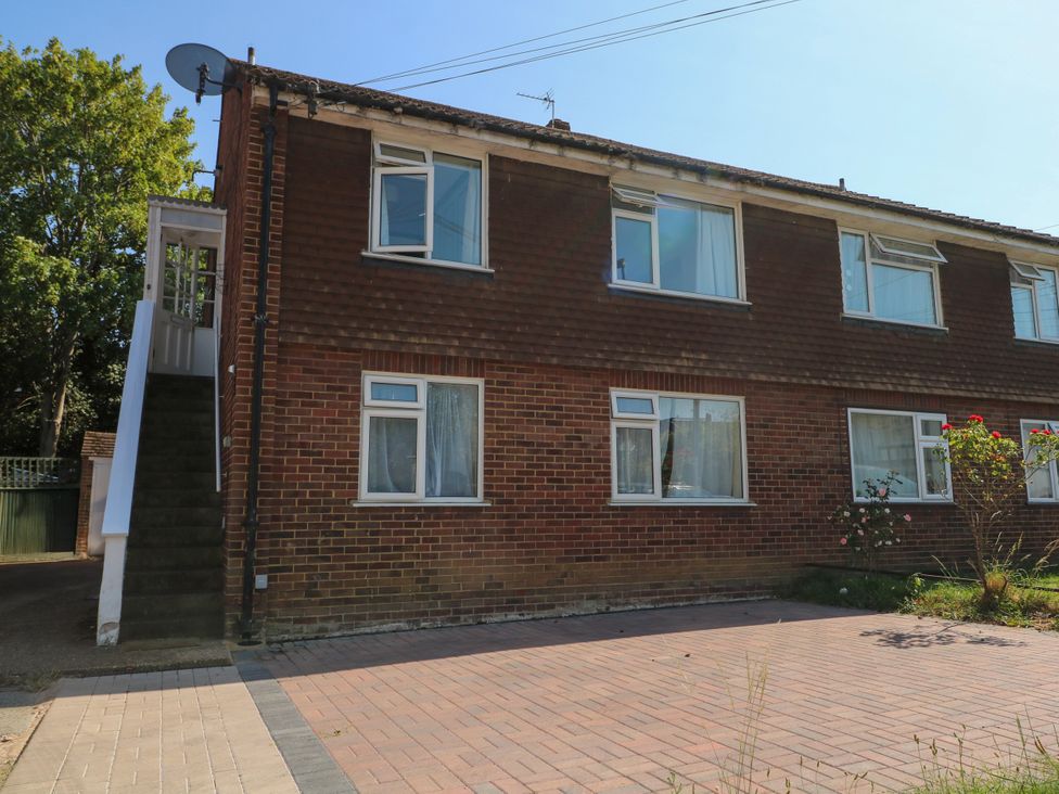 A building with stairs and windows at Sussex Close in New Malden