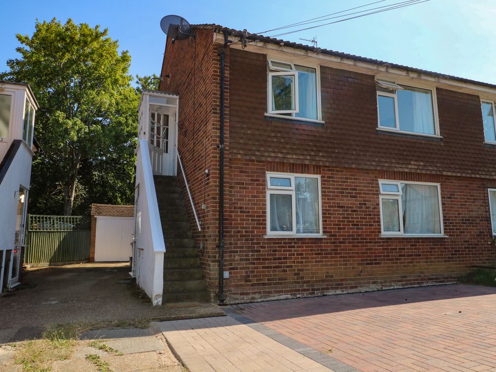 A building with a staircase and driveway at Sussex Close New Malden