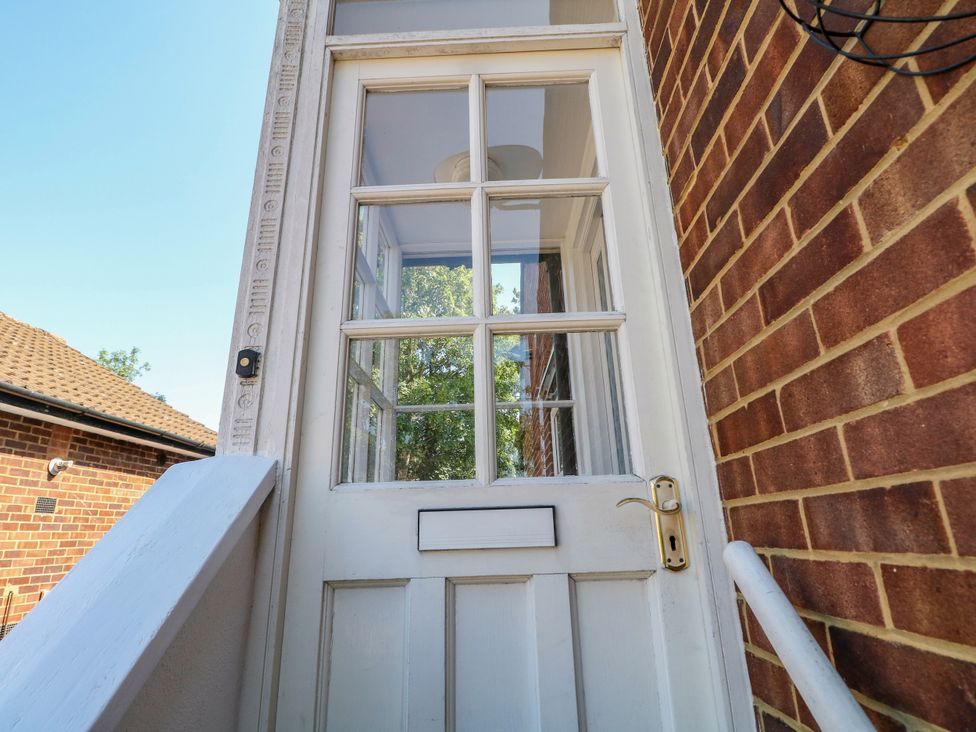 A door with windows and steps at Sussex Close in New Malden