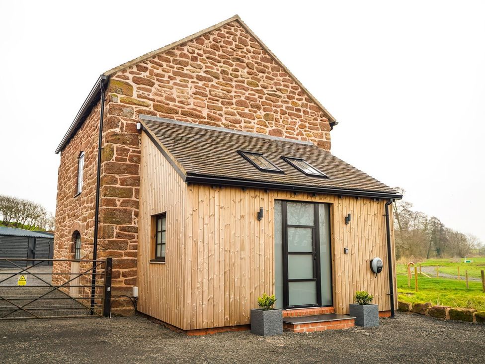 A house with stone and wood exterior at The Old Mill Great Bolas near Telford