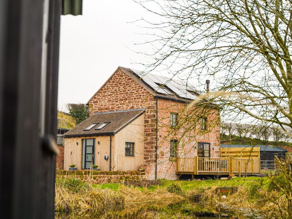 A house with a deck and solar panels at The Old Mill in Great Bolas near Telford