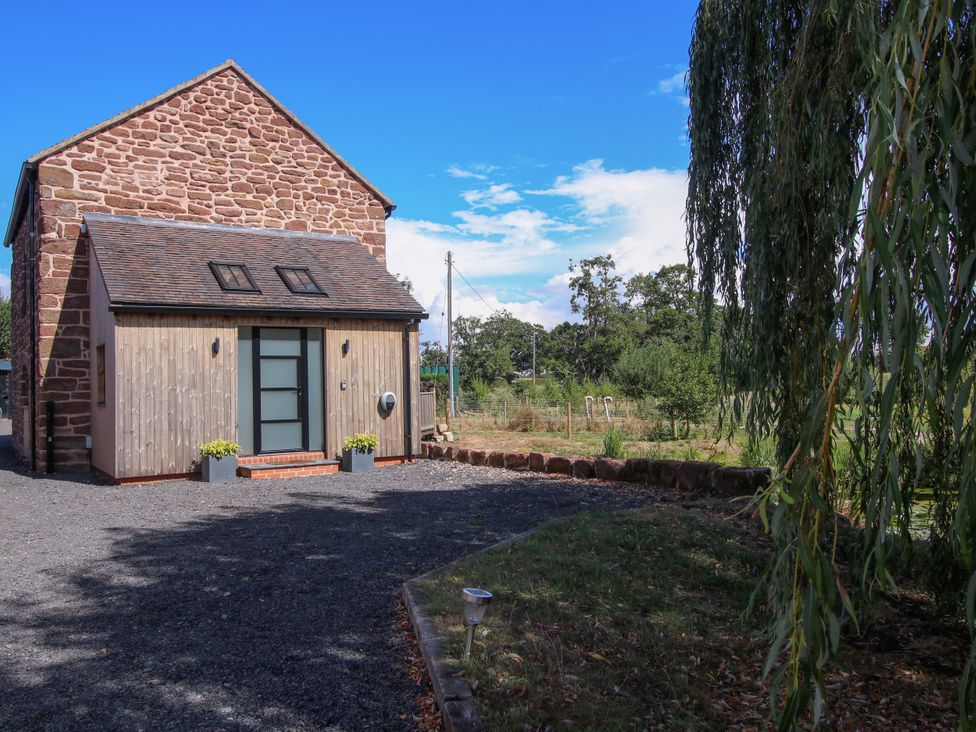 An exterior view of a house with a gravel driveway at The Old Mill Great Bolas near Telford