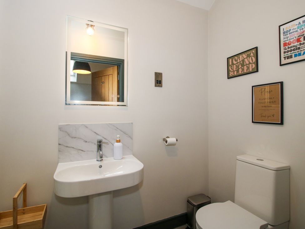 A bathroom with a sink and toilet at The Old Mill in Great Bolas near Telford