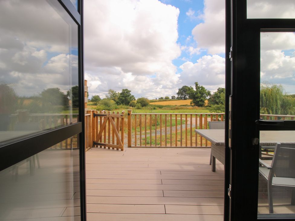 An outdoor area with a view of a field at The Old Mill in Great Bolas near Telford