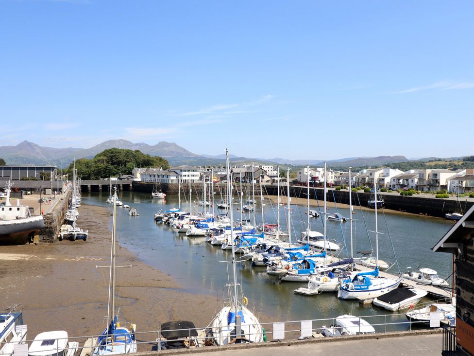 A marina with boats in water at Cnicht View in Porthmadog