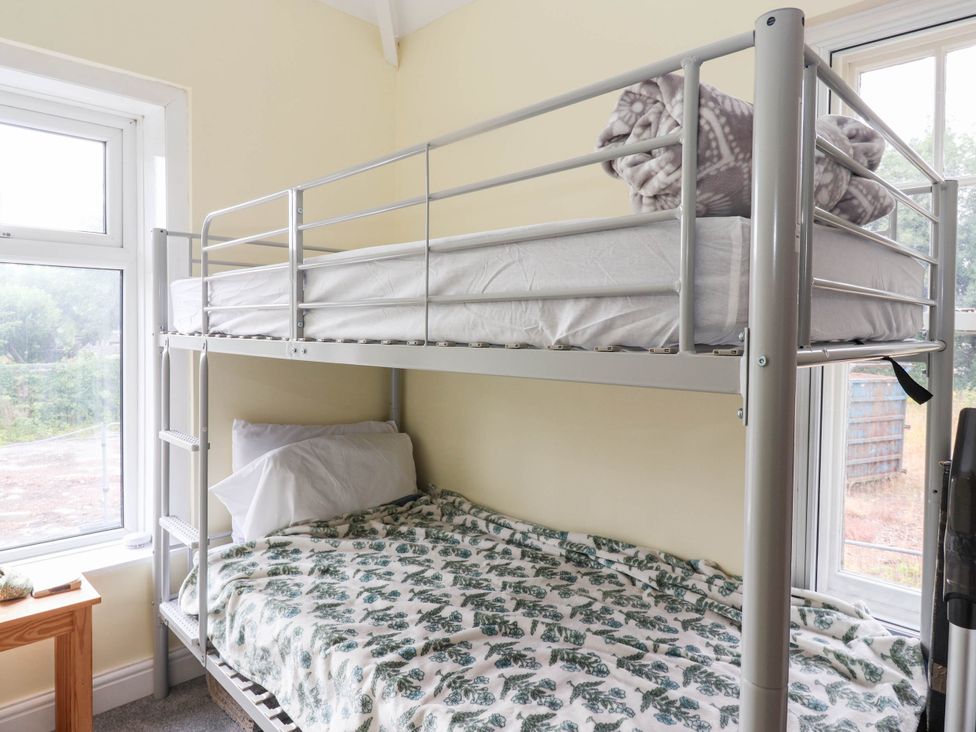 A bunk bed with a window in a bedroom at Burras Hill in Otley