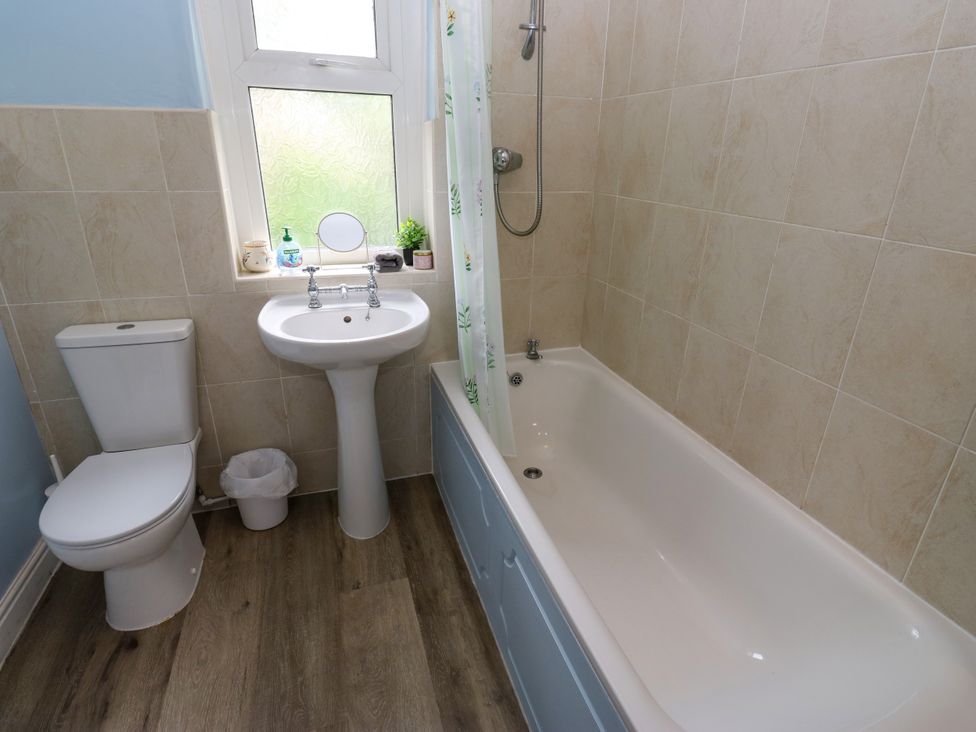 A bathroom with a toilet sink bathtub and shower at Burras Hill in Otley