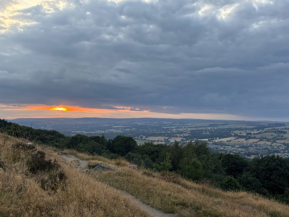 A sunset view over hills and valleys at Burras Hill in Otley