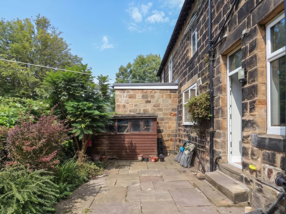 An outdoor area with plants and a shed at Burras Hill in Otley