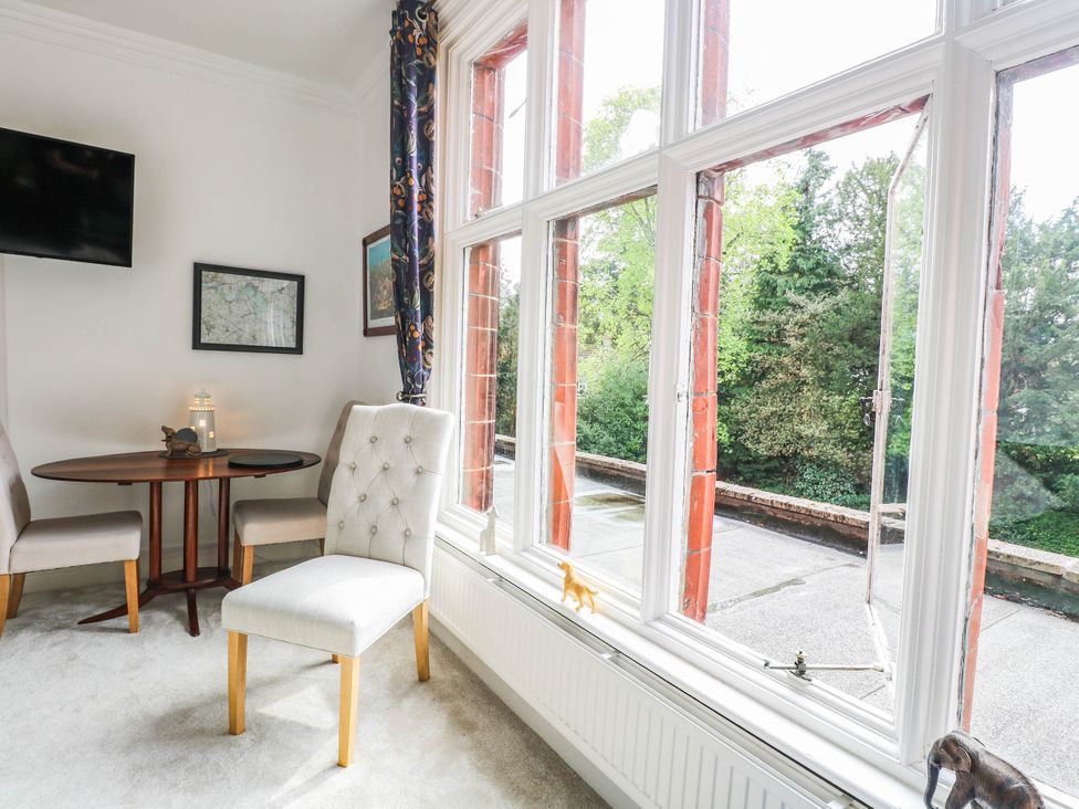 A dining room with a table and chair at 10 Uplands Court in Brundall