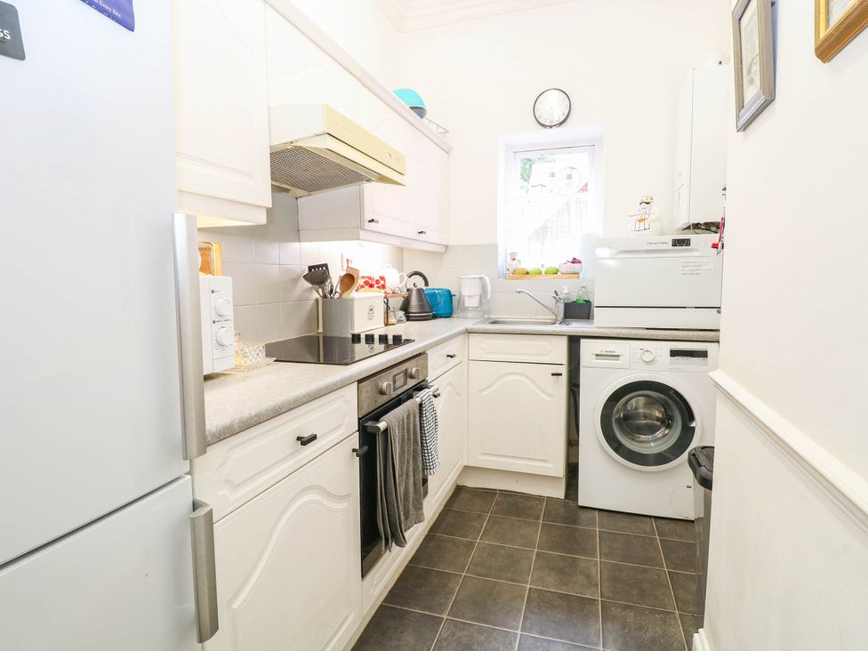 A kitchen with appliances and a window at 10 Uplands Court Brundall