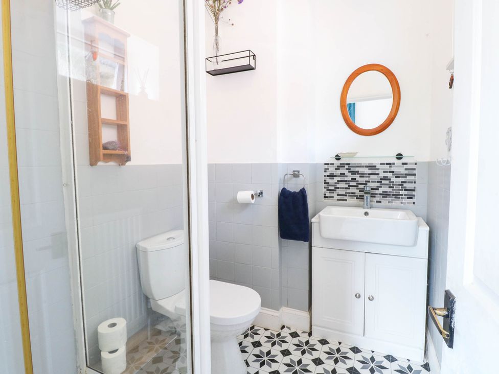 A bathroom with a sink and toilet at 10 Uplands Court in Brundall