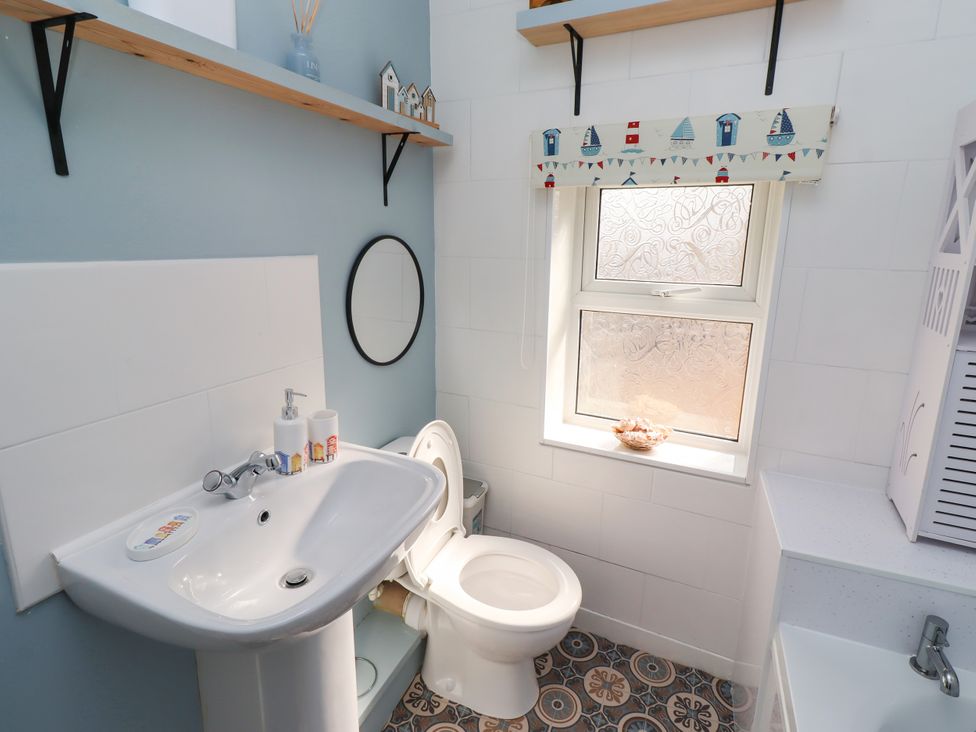 A bathroom with a sink and toilet at The Old Bank House near Amble