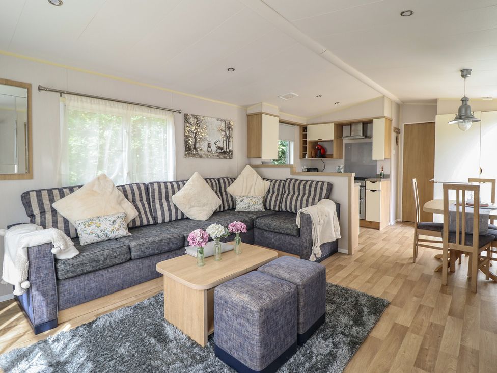 A living room with a sofa and coffee table at Plot 13A