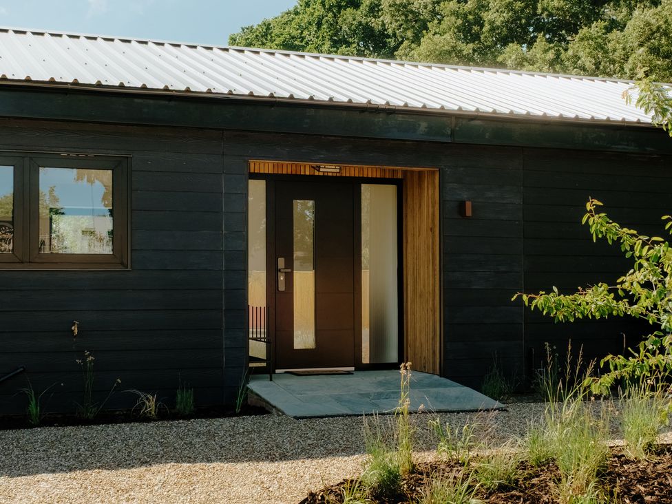 An exterior entryway with door and windows at Baldslow Barn Battle near Hastings