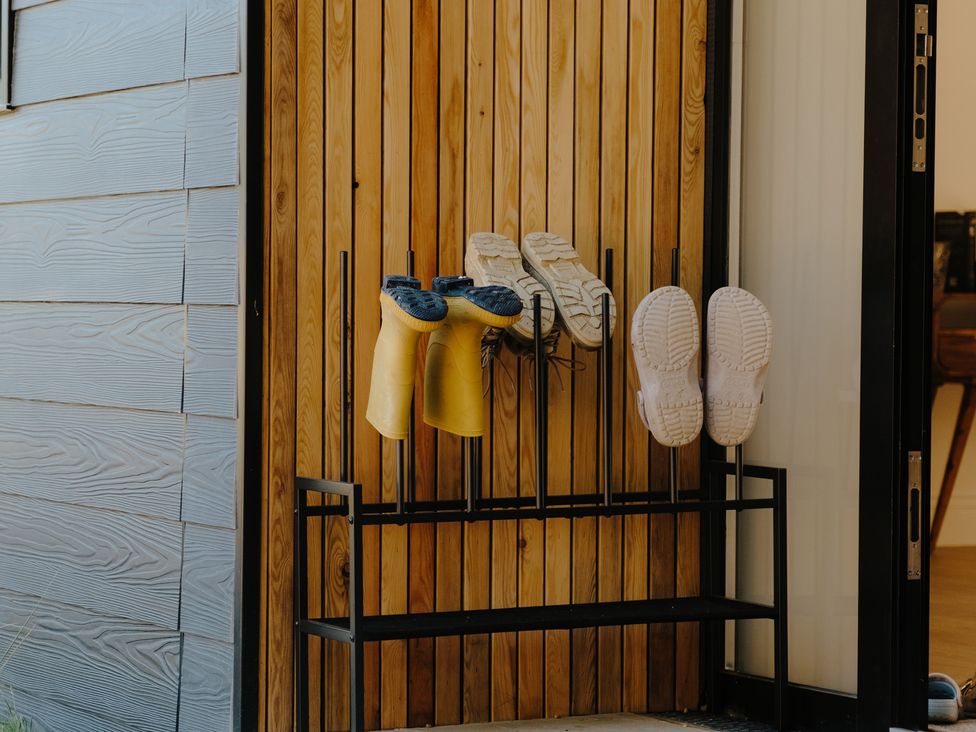 A shoe rack with boots and shoes at Baldslow Barn Battle near Hastings