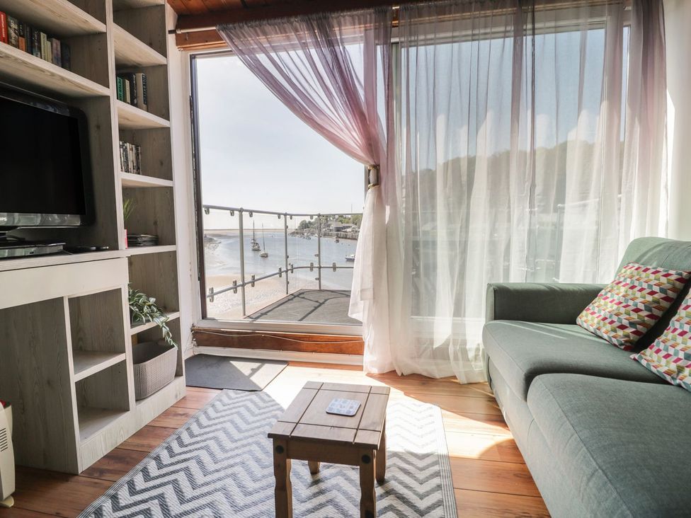 A living room with a sofa and coffee table at Seafarer's Haven in Porthmadog